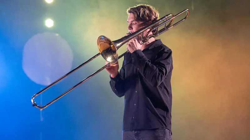 Student playing an instrument